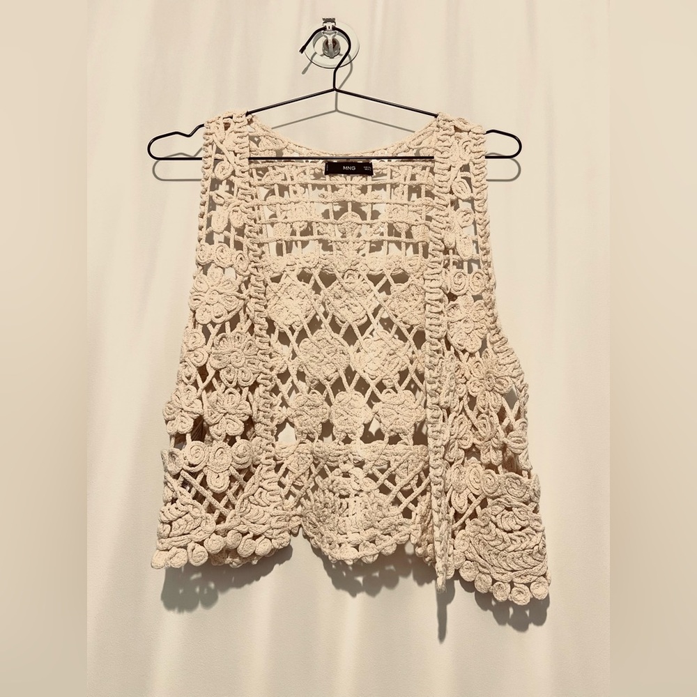 Cropped crochet vest.